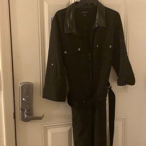 Black zip front knee length dress with faux leather on the collar and sleeves